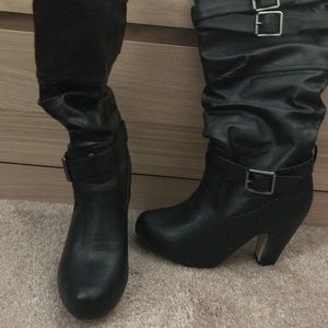 Black leather boots with buckle